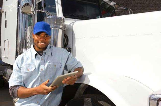 An Atlanta to Boston Auto Transport driver prepares a vehicle for shipment
